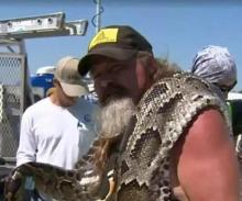 Dusty "Wildman" Crum with his 16-foot-10 python