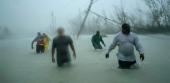 Rescuers fight their way through staggering levels of flooding