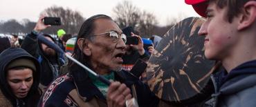 Nathan Phillips and high schooler Nick Sandmann