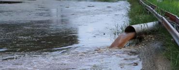 Raw sewage polluting a waterway