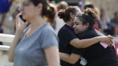 Junior Guadalupe Sanchez, 16, cries in her mother's arms