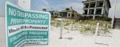 Signs similar to this one have been banned in front of beachfront property in Walton County