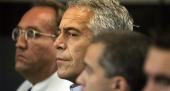 Jeffrey Epstein, center, in custody in WPB in 2008