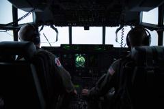 Maj. Kendall Dunn and Lt. Col. Ivan Deroche fly a WC-130J Maj. Kendall Dunn and Lt. Col. Ivan Deroche fly a WC-130J